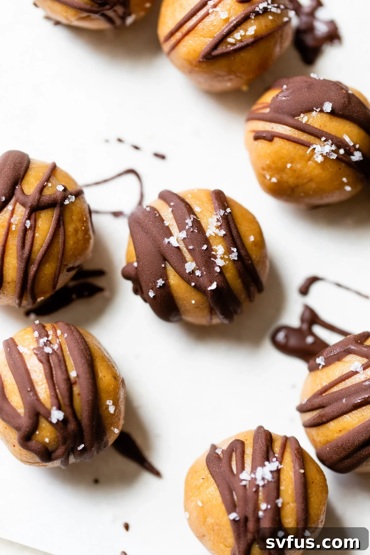 Irresistible Healthy Peanut Butter Balls with a delicate chocolate drizzle, perfect for a quick snack or dessert.