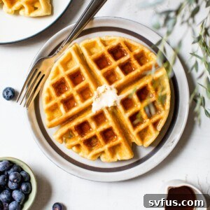 Paleo Waffle on a plate with butter, ready to be served.