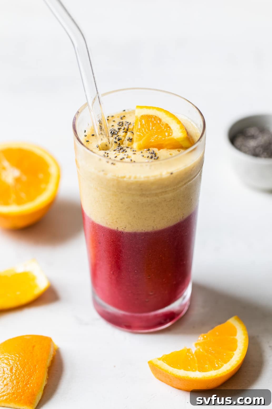 layered pink and orange smoothie, a healthy and delicious Raspberry Orange Smoothie