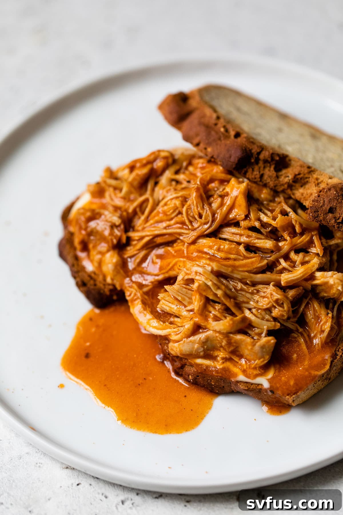 shredded chicken on a sandwich