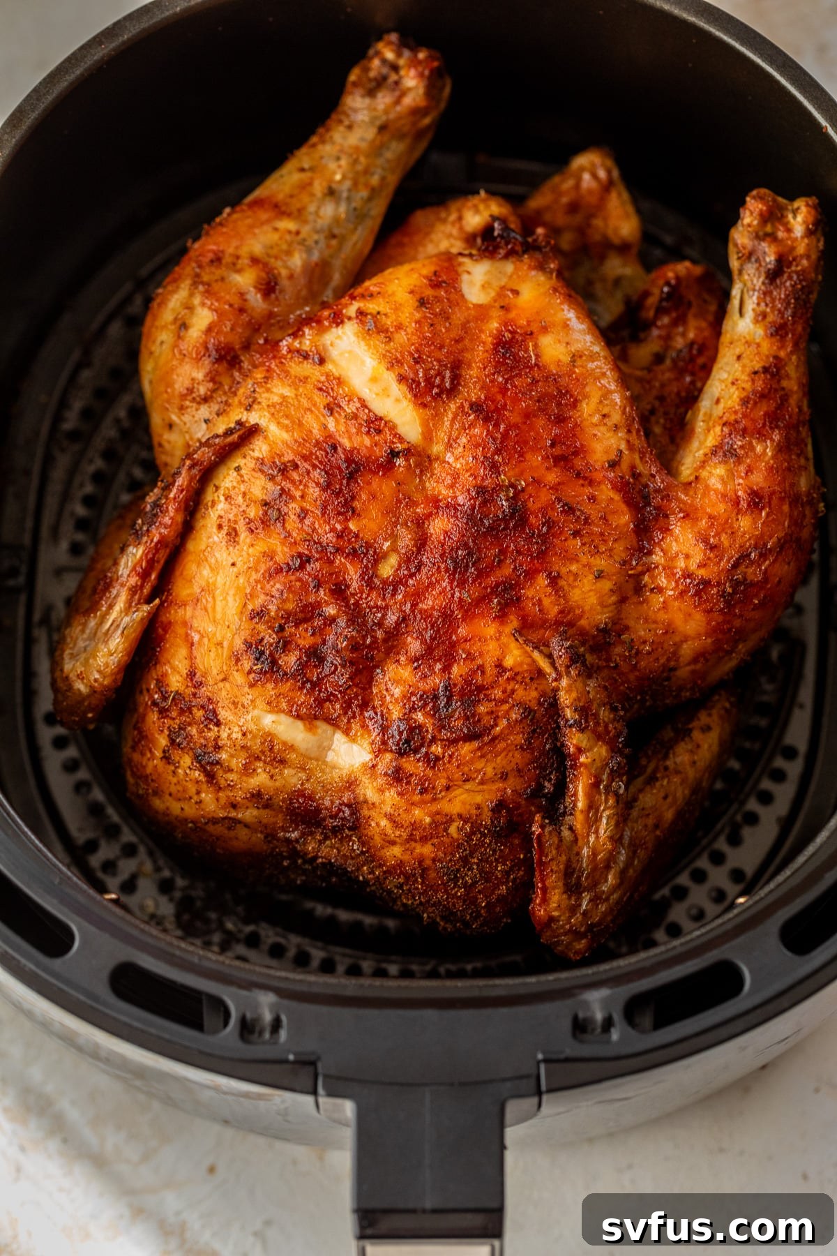 whole chicken inside an air fryer