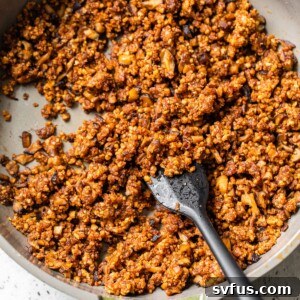 blended seasoned walnuts and mushrooms in a skillet