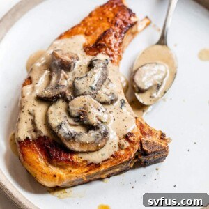 bone-in porch chop on a plate with mushroom sauce