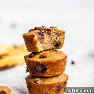 A stack of perfectly baked coconut flour banana muffins with chocolate chips.