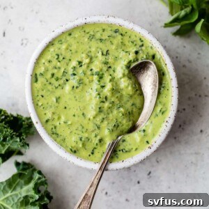 bowl of pesto with a spoon in it