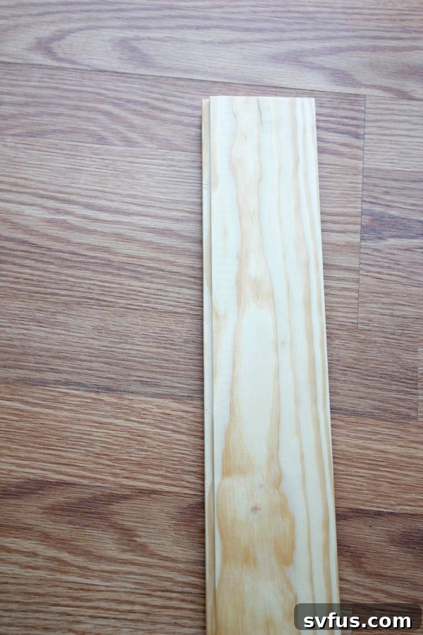 Man selecting tongue and groove planks at Home Depot