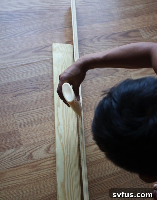Close-up of wooden planks being pressed together