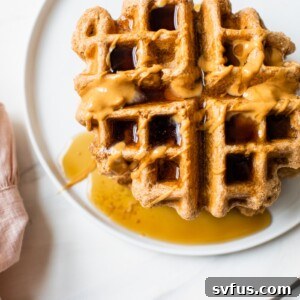waffles topped with peanut butter and maple syrup