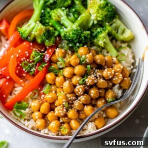 bowl filled with rice, broccoli, red bell pepper, and marinated chickpeas