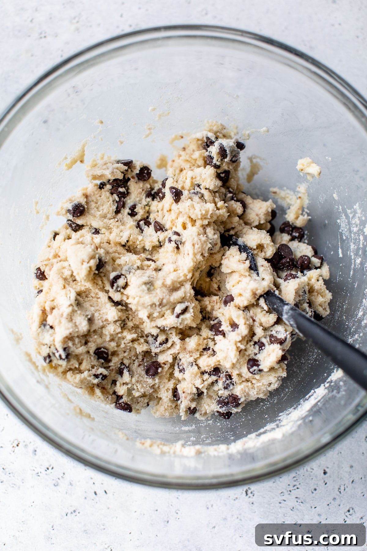 Scone batter in a large glass bowl before forming.