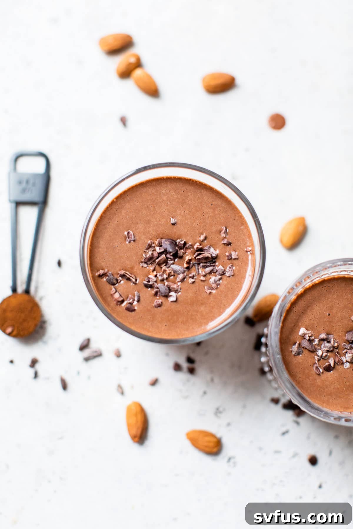 Overhead shot of a delicious chocolate mocha smoothie, topped with crunchy cacao nibs, ready to be enjoyed.