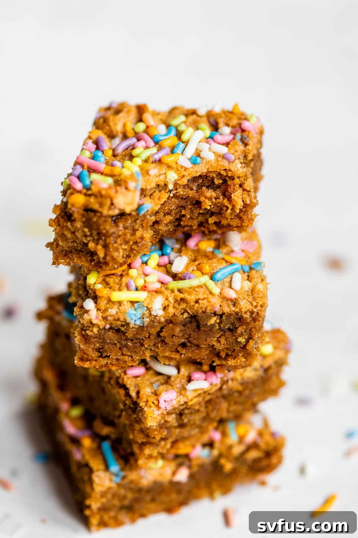 a stack of brownies with sprinkles
