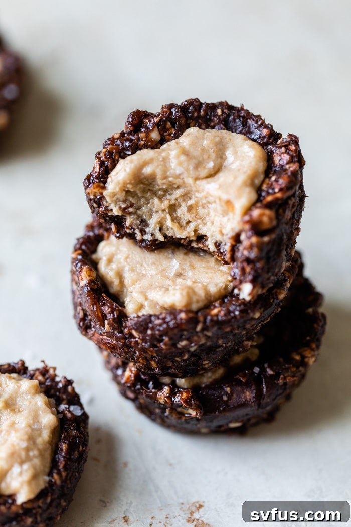 A beautiful stack of five vegan chocolate caramel thumbprint cookies.
