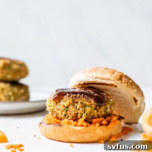 burger on a bun with shredded carrots around