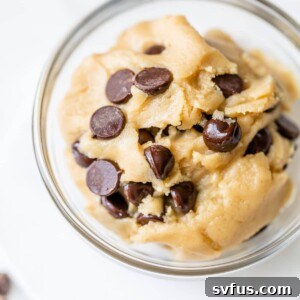 A small glass bowl filled with rich, chocolate chip edible vegan cookie dough