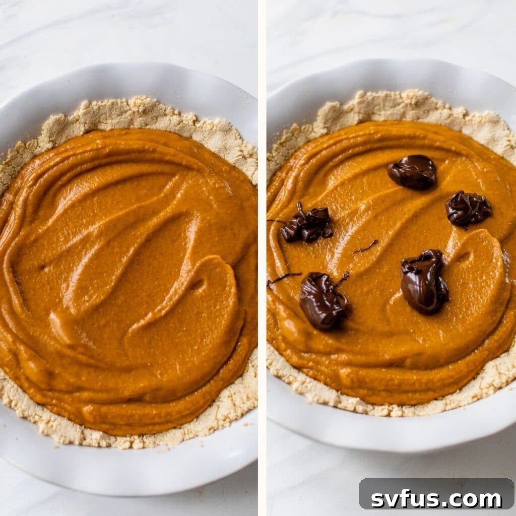 Close-up of a pumpkin pie with dollops of melted dark chocolate on top, ready for swirling.