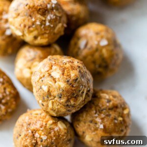 several energy balls made with nut butter and oats on a white plate