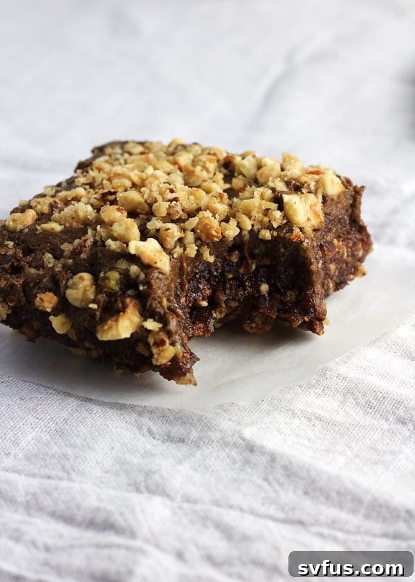 Close-up of a raw vegan Nutella brownie square, showing the rich texture.