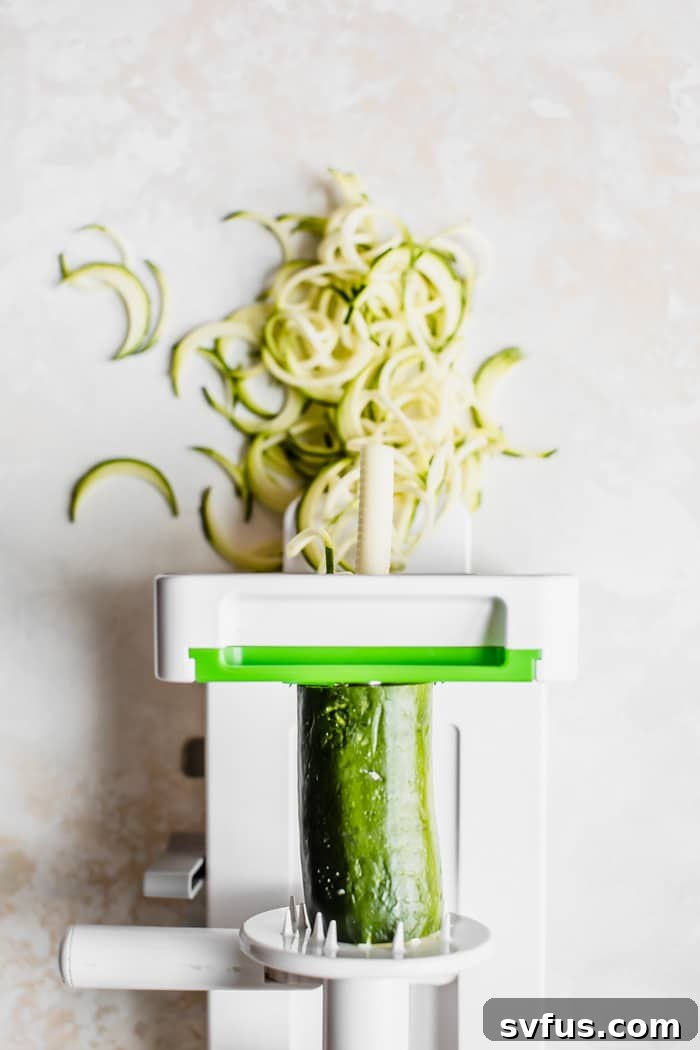Freshly spiralized zucchini noodles, ready for cooking and serving.