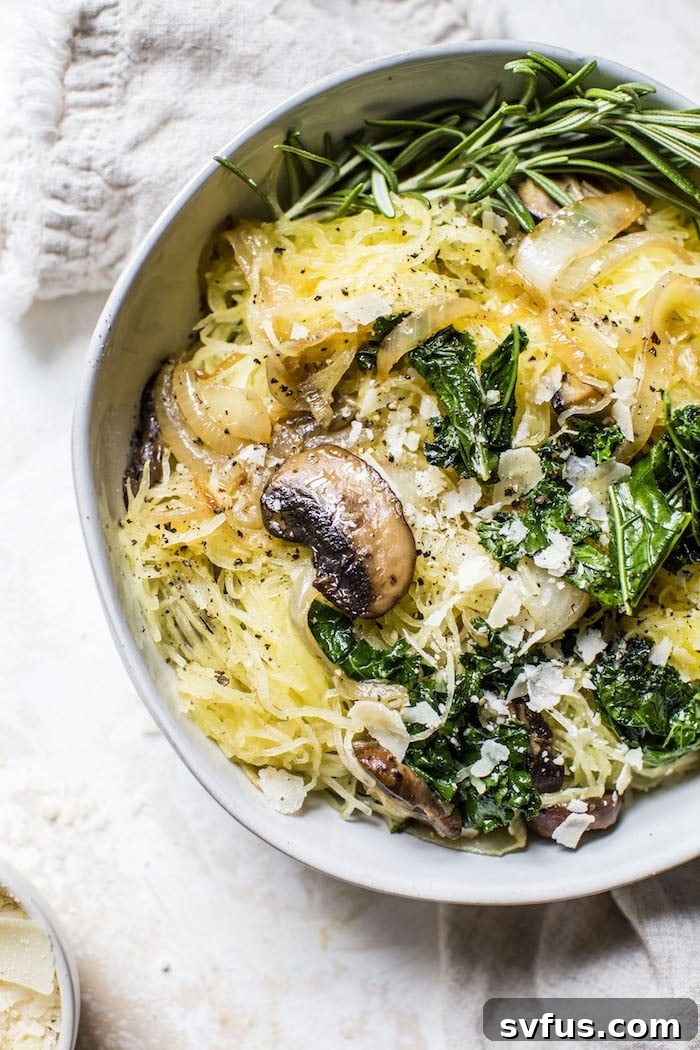 A large spaghetti squash, cut in half, showcasing its yellow flesh and seed cavity, ready for roasting.