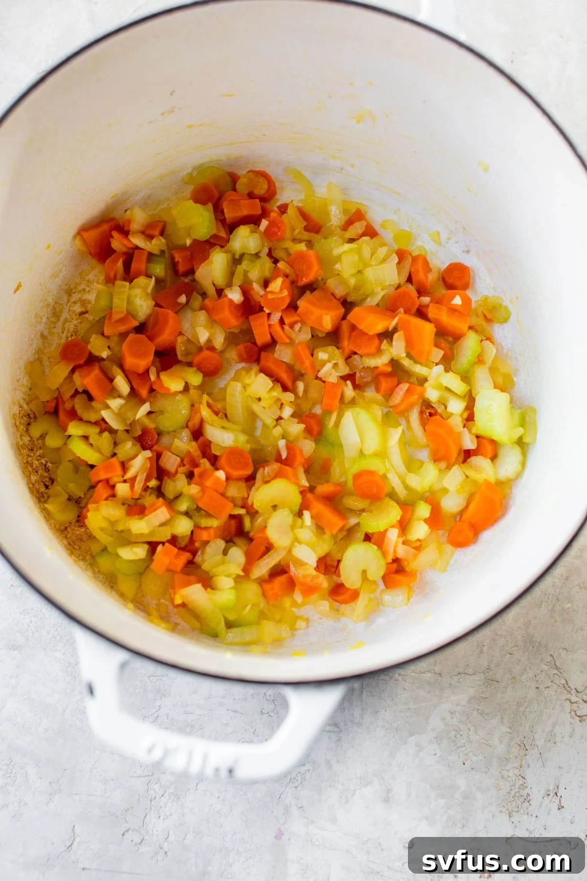 Sautéed carrots, celery, onion, and garlic in a Dutch oven.