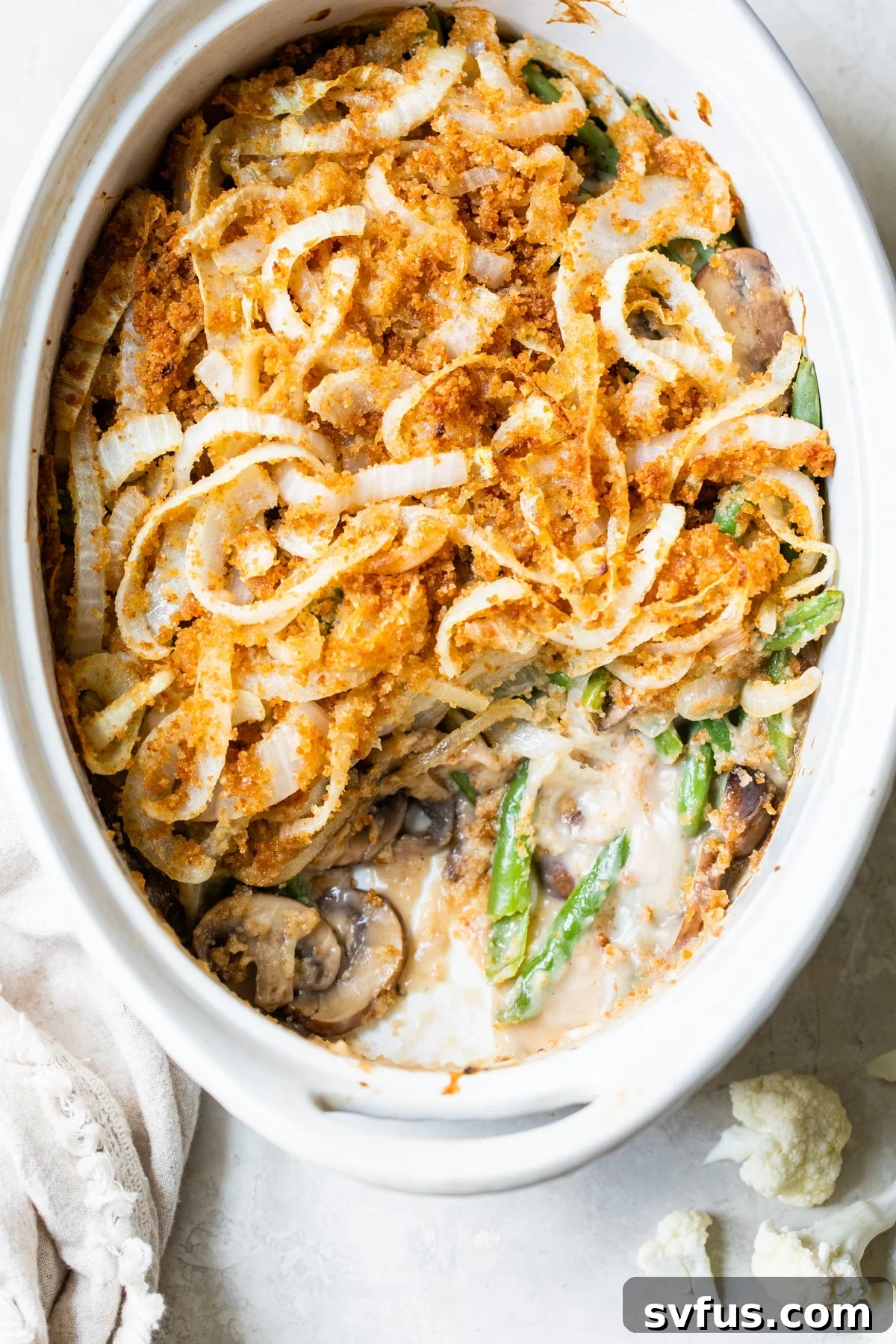 Green bean casserole in an oval dish, ready to serve.