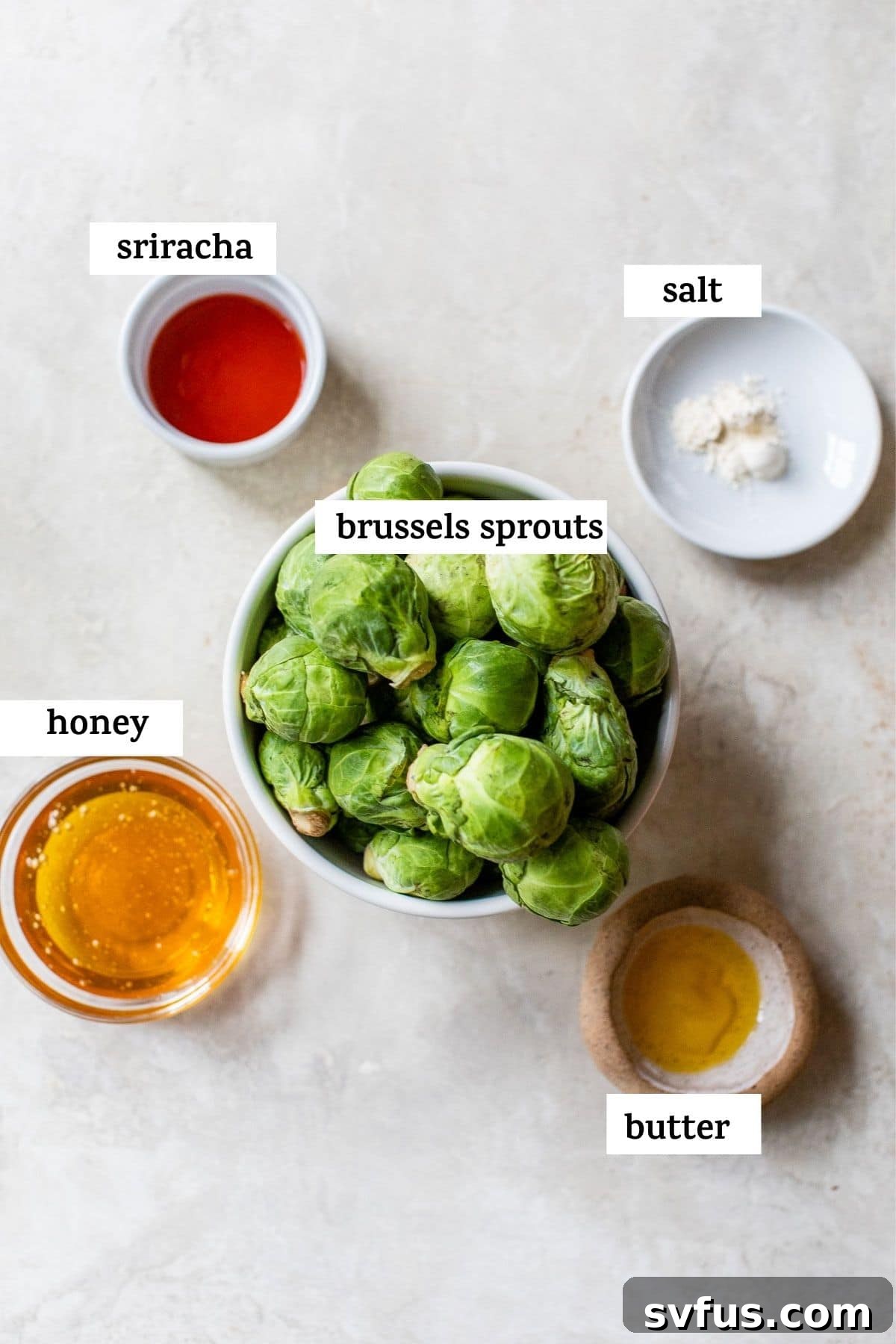 A bowl of Honey Sriracha Brussels Sprouts, garnished and ready to serve, with an inviting text overlay.