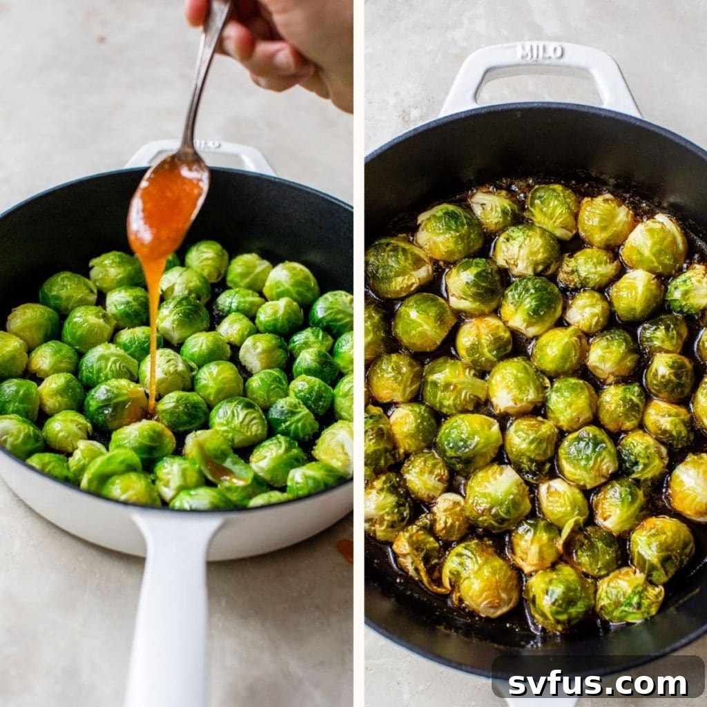 Someone drizzling the vibrant honey sriracha sauce over a skillet full of cooked Brussels sprouts.