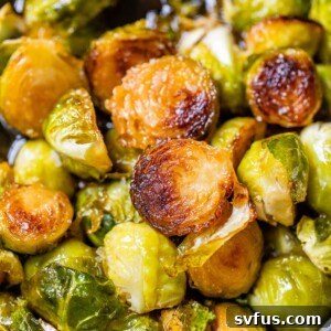 Close up photo of fried brussels sprouts, showcasing crispy texture.