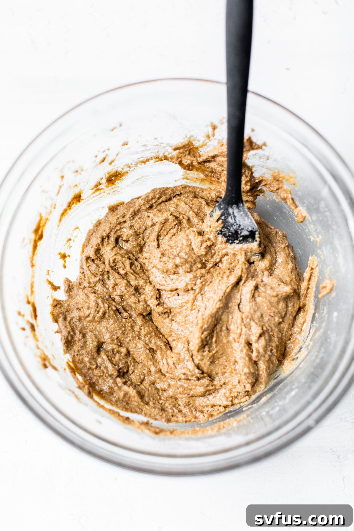 breakfast bar batter in a glass bowl, mixture is thick and ready for baking