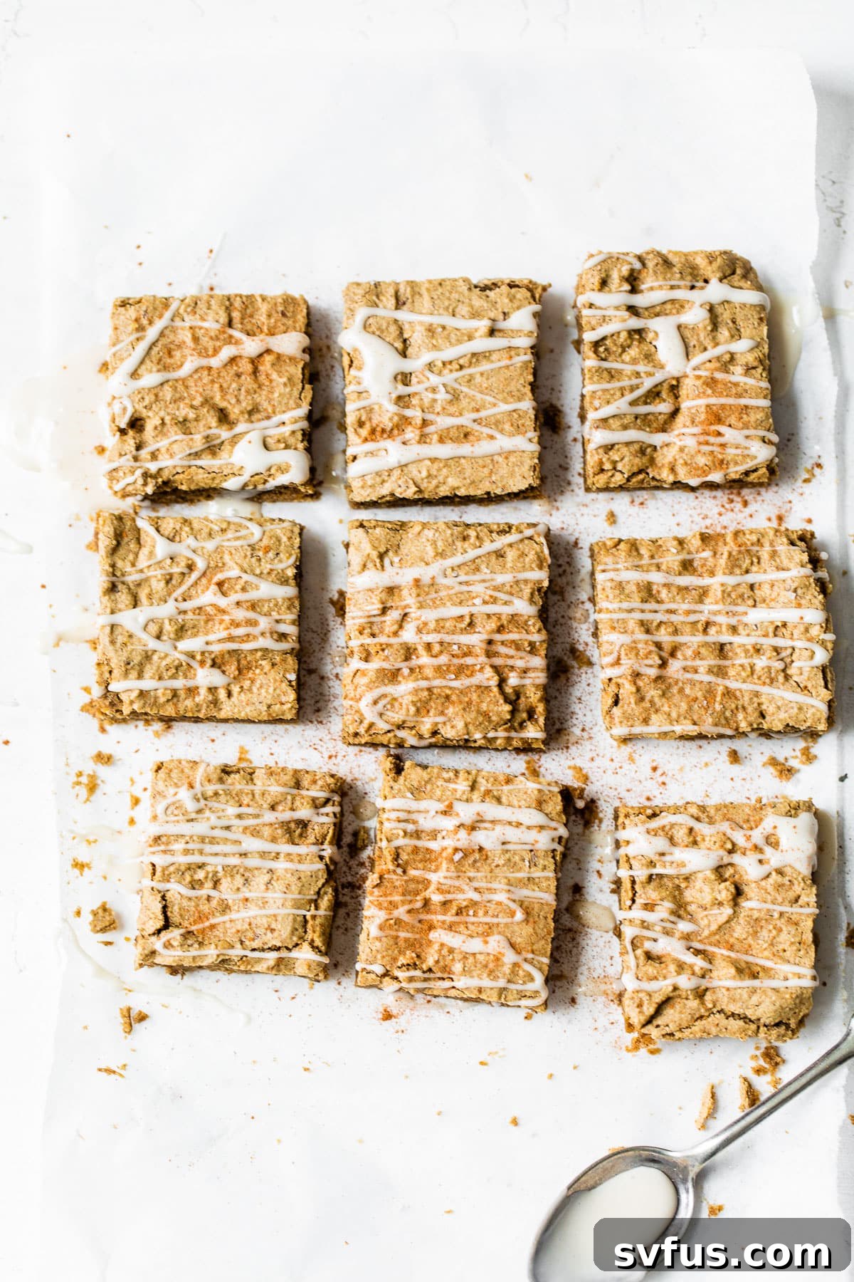 cut protein bars on parchment paper, perfectly cooled and ready