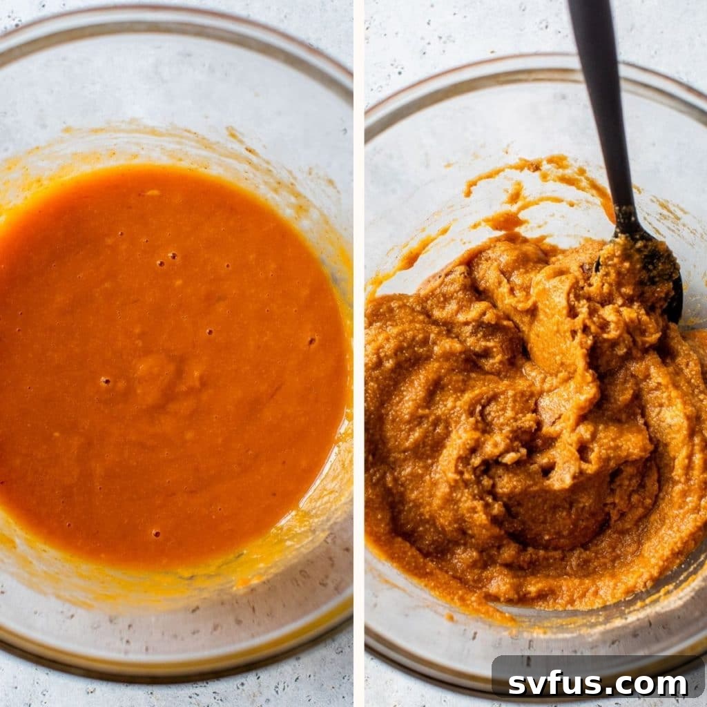 Vibrant orange muffin batter, a harmonious blend of wet ingredients, rests in a clear glass bowl, ready for the next step.