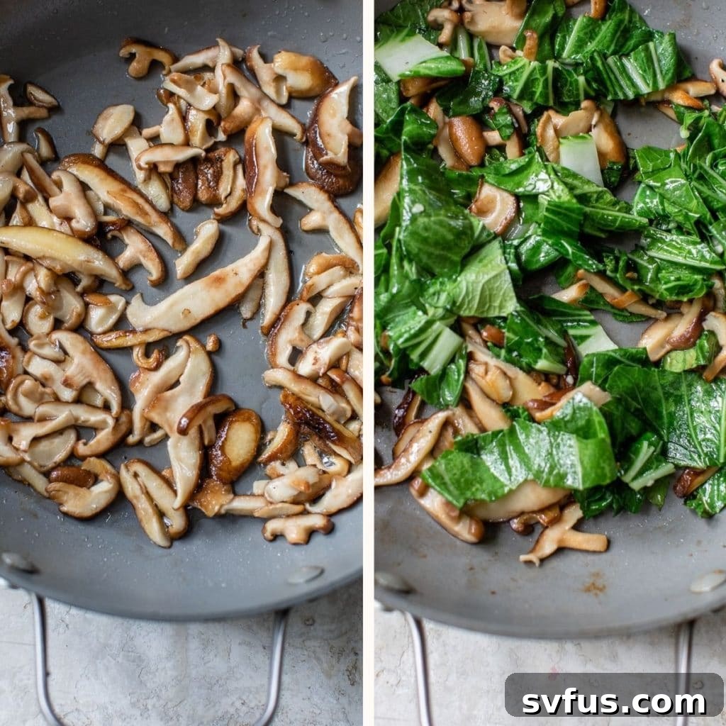 A cast iron skillet filled with sautéed shiitake mushrooms and tender bok choy, simmering before the noodles are added.