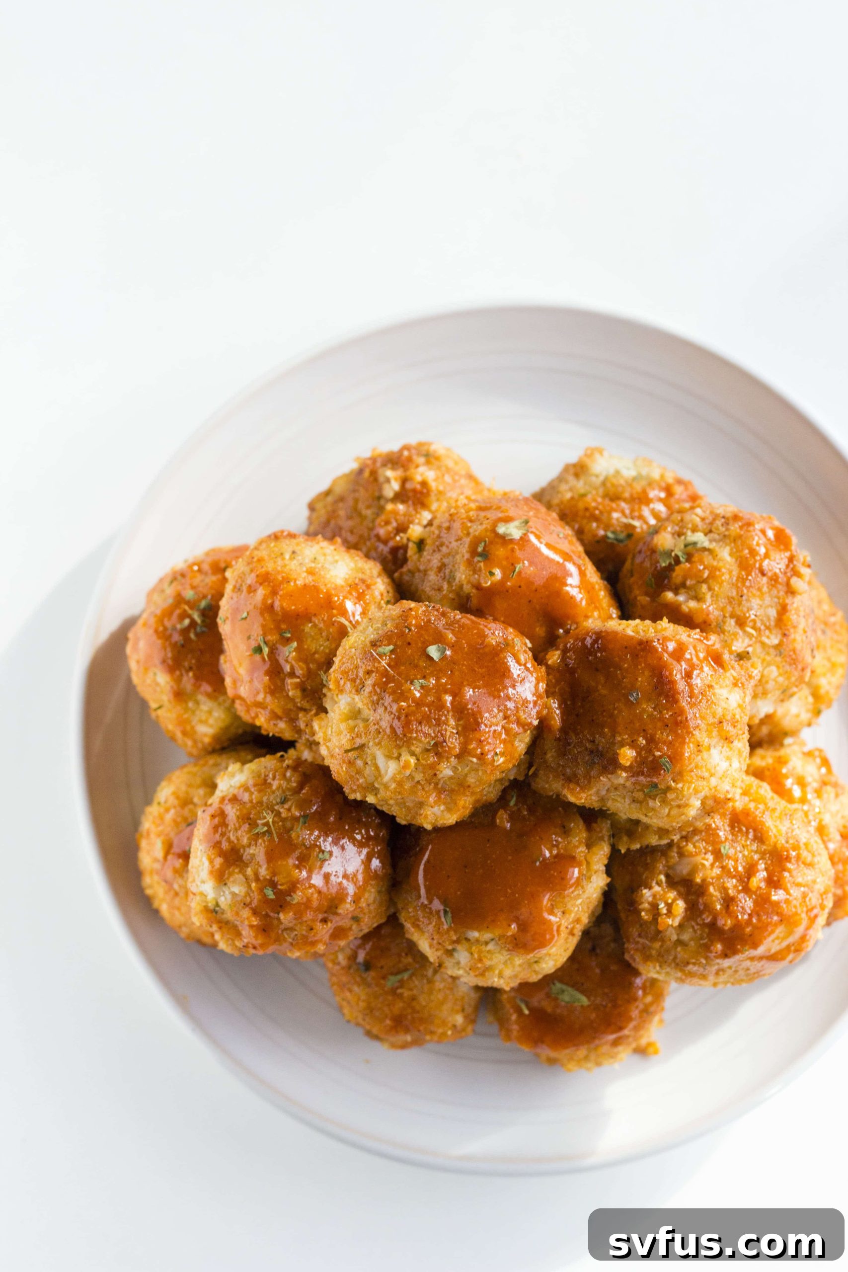 Forming Buffalo Cauliflower Quinoa Meatballs by hand.