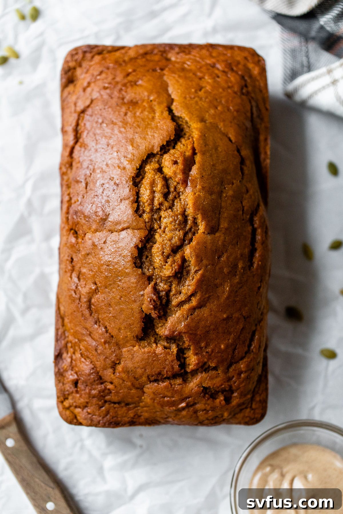 baked pumpkin bread on parchment paper