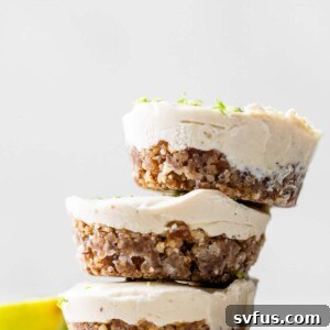 Close-up of a beautifully presented vegan key lime pie tart, showing its creamy texture and vibrant color.