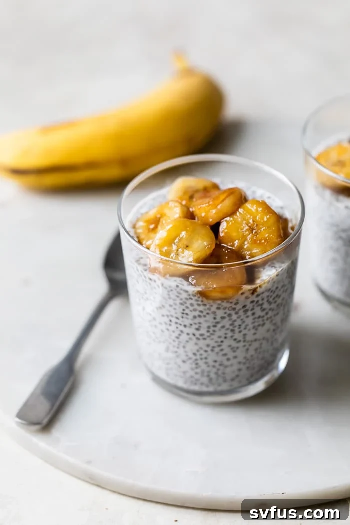 Creamy coconut chia pudding in a glass jar, topped with golden caramelized banana slices and a sprinkle of shredded coconut, ready to eat.