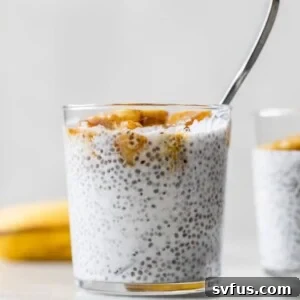 Creamy coconut chia pudding in a glass topped with golden caramelized bananas.