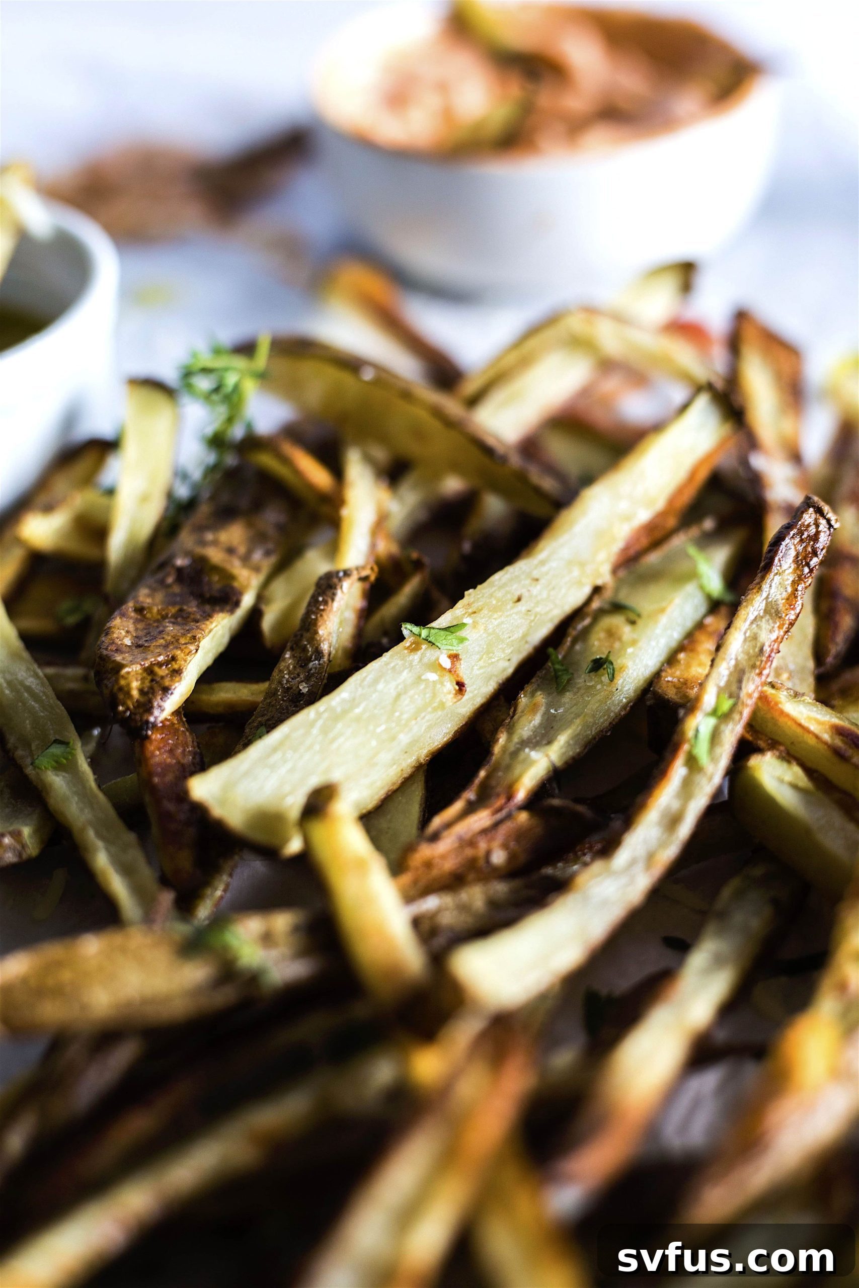 A diverse selection of delicious condiments for a DIY French Fry Bar, including classic and gourmet dipping sauces.