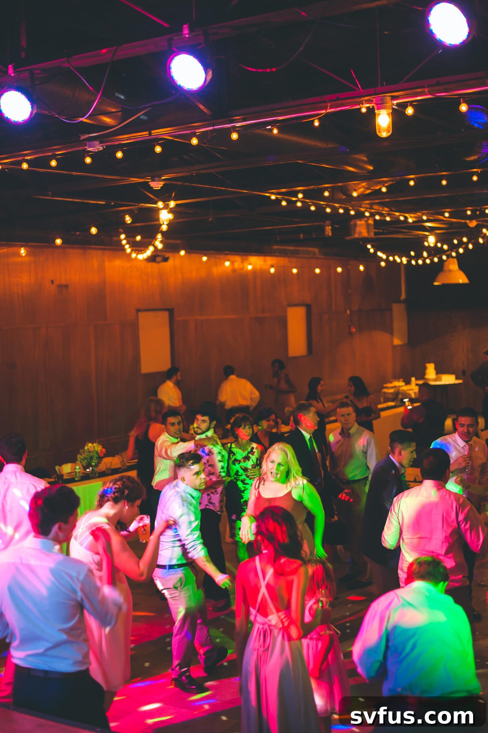 Joyful dancing on the reception floor, celebrating the newlyweds