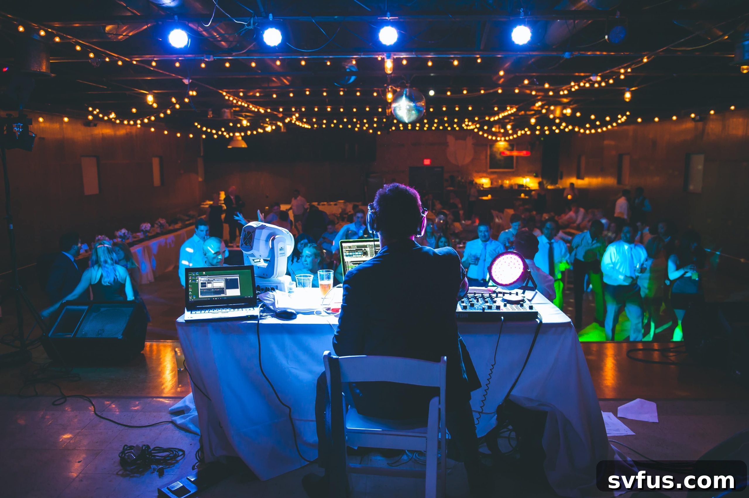 Guests enjoying the lively atmosphere and dancing at the wedding reception