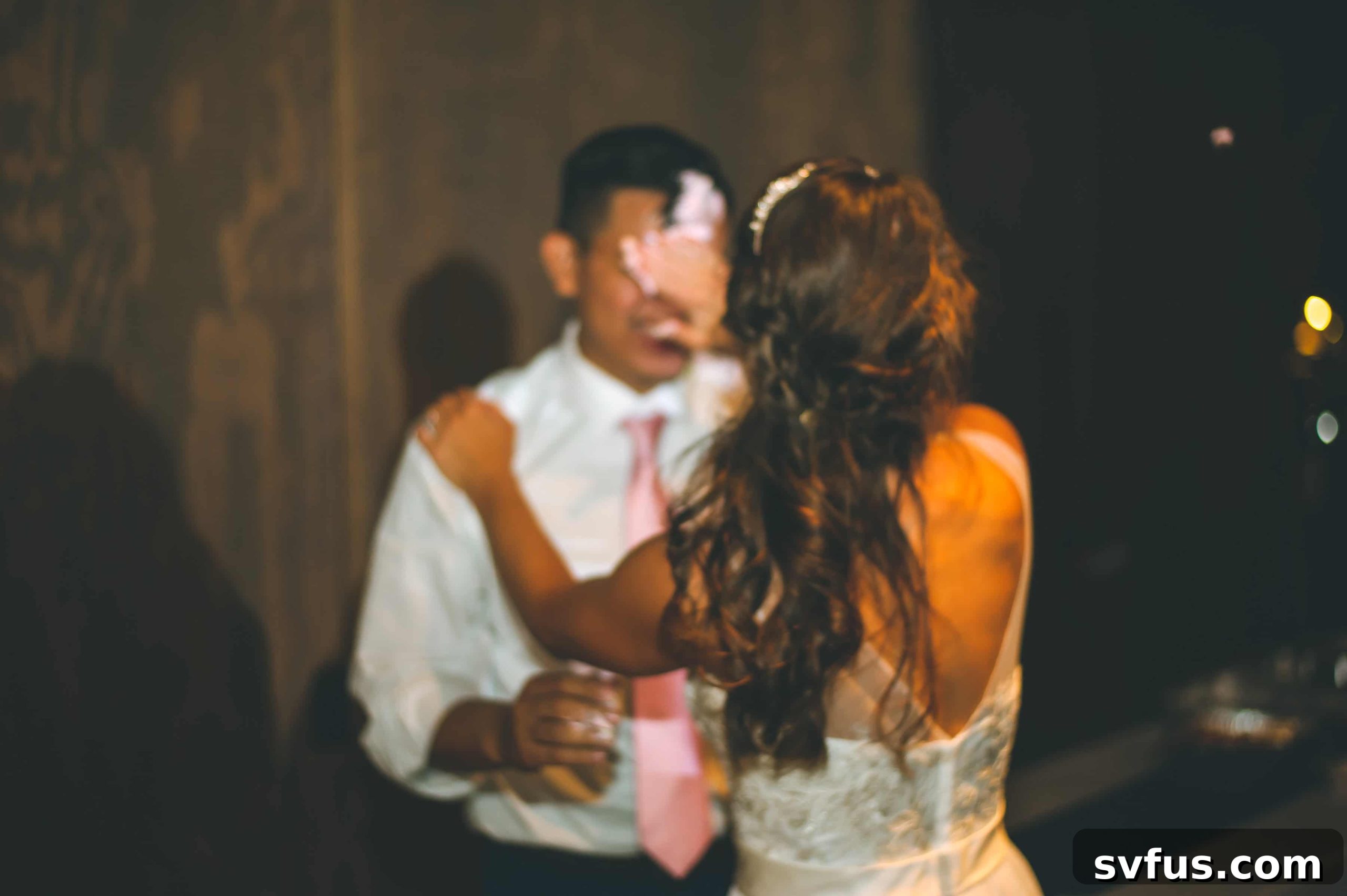 Groom celebrating with friends on the dance floor, pure jubilation