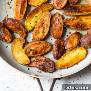 close up of crispy roasted fingerling potatoes in a small bowl