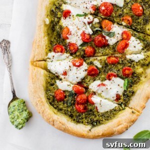 sliced pizza on parchment paper