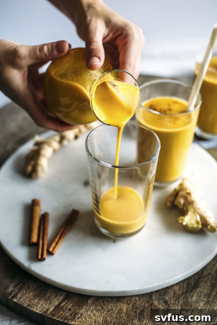 Delicious and vibrant Ginger Pumpkin Smoothie in a tall glass, garnished with spices, highlighting its autumnal appeal.