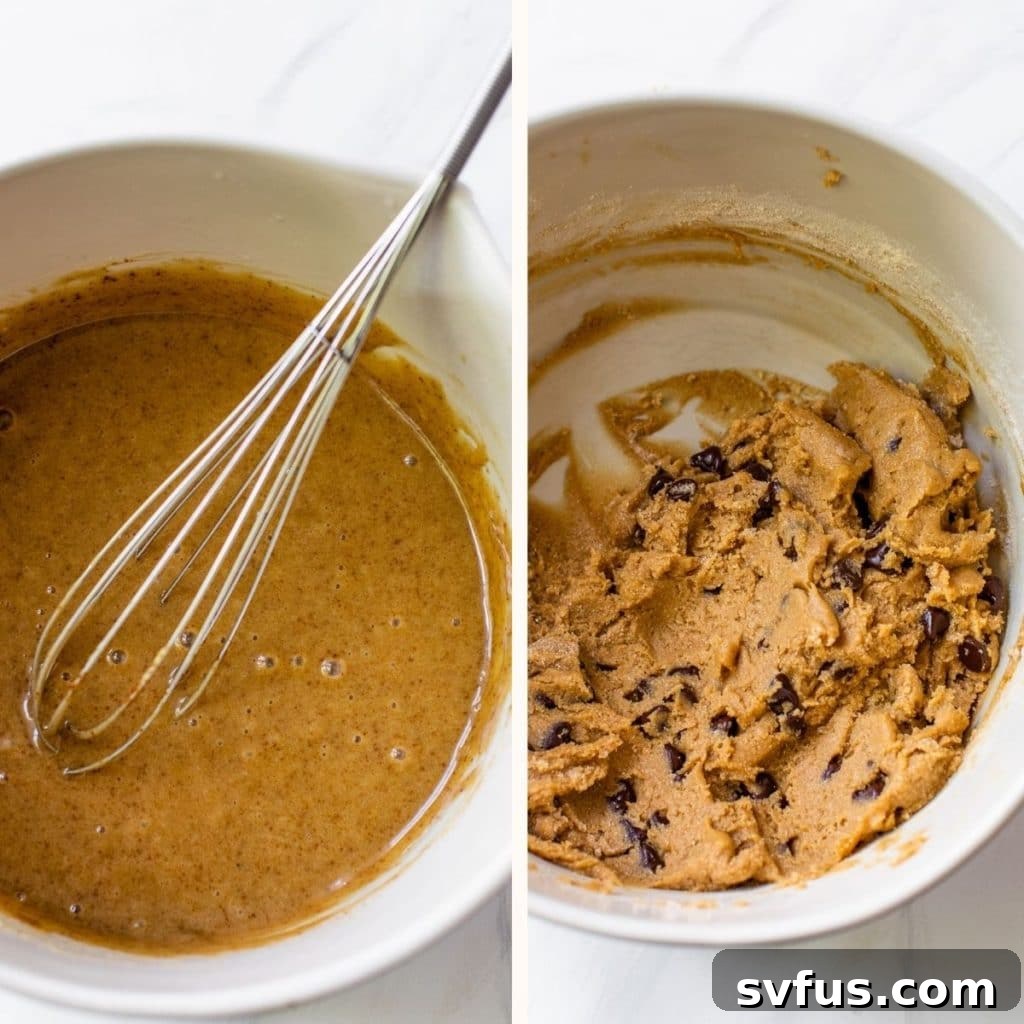 Thick, chocolate chip cookie dough in a large white mixing bowl, ready for scooping and baking.