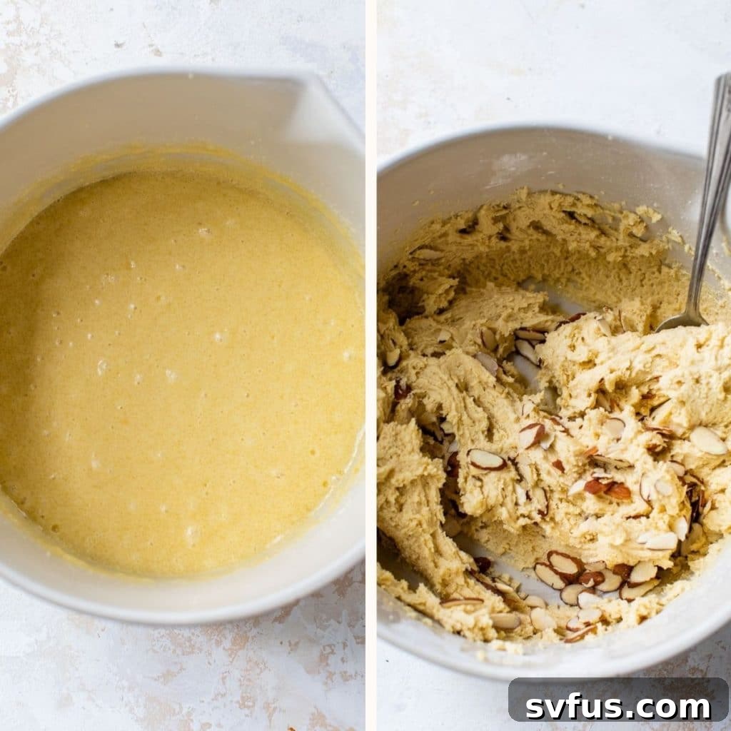 A white mixing bowl filled with creamy, light colored biscotti dough, ready for the addition of almonds.