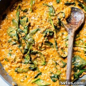 farro, spinach and sweet potato in a skillet
