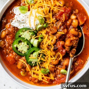 A smaller image of the Black Eyed Peas Beer Chili bowl, topped with cheese and sour cream.