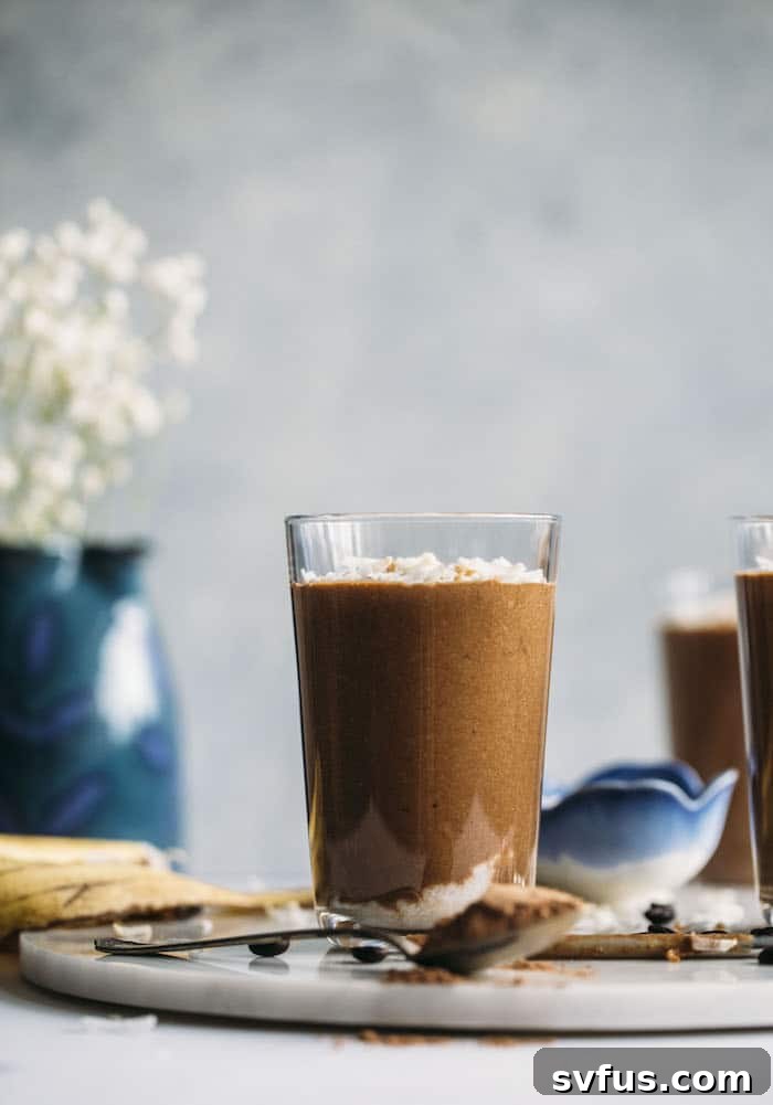 A vibrant, delicious Toasted Coconut Espresso Smoothie in a glass, garnished with extra toasted coconut flakes, ready to be enjoyed as a healthy breakfast or an energizing afternoon treat.
